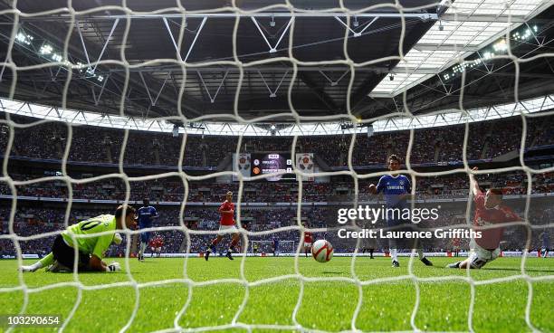 Javier Hernandez of Manchester United scores past Henrique Hilario of Chelsea during the FA Community Shield match between Chelsea and Manchester...