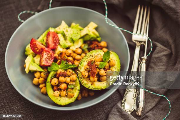 superfood salad with avocado, chickpeas and dried tomato - chick pea salad stock pictures, royalty-free photos & images