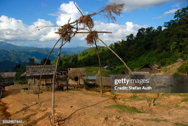 poverty, natural religion, animism, belief in spirits, belief in ghosts, spirits swing at the village entrance, village of the akha nuqui ethnic group in the mountains, simple huts, ban changteun, phongsali district and province, laos, southeast asia - animism stock pictures, royalty-free photos & images