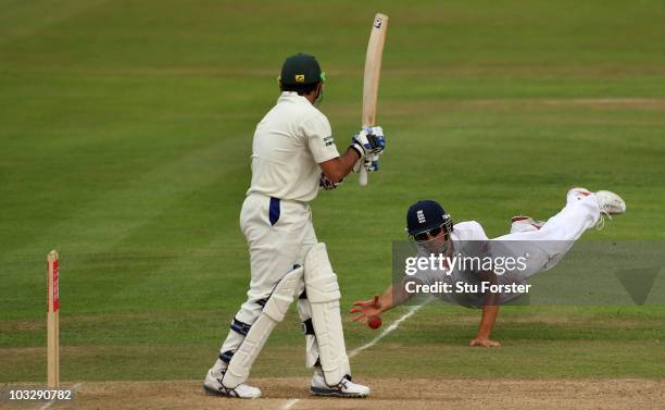 Pakistan batsman Saeed Ajmal looks on as England fielder Alastair Cook just fails to take a catch during day three of the 2nd npower test match...