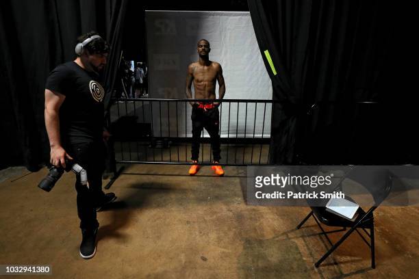 Boxer Terrel 'Tyger' Williams is waits to be photographed by a photographer prior to his weigh-in for his bout against David Grayton at 2300 Arena on...