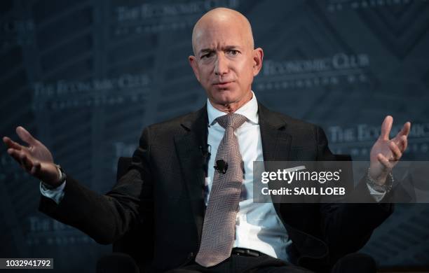 Jeff Bezos, founder and CEO of Amazon, speaks during the Economic Club of Washington's Milestone Celebration event in Washington, DC, on September...