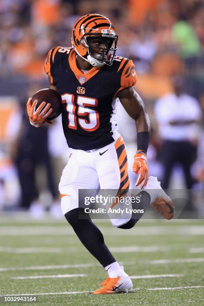 John Ross of the Cincinnati Bengals runs with the ball during the first half against the Baltimore Ravens at Paul Brown Stadium on September 13, 2018...