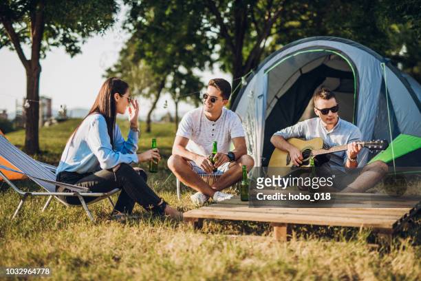 camping with friends - music festival grass stock pictures, royalty-free photos & images
