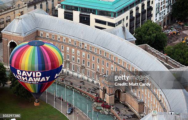 Hot air balloon flies above Bristol city centre on August 9, 2010 in Bristol, England. The dawn flight was a preview for the International Balloon...