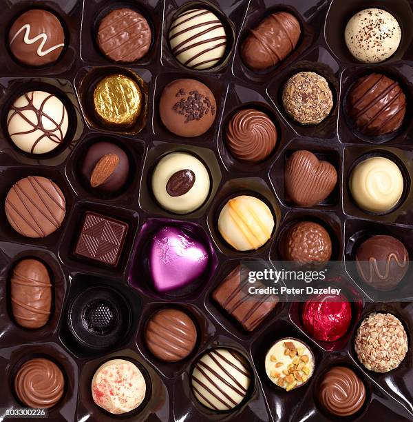 assortment of sweets in box one missing - chocolate fotografías e imágenes de stock
