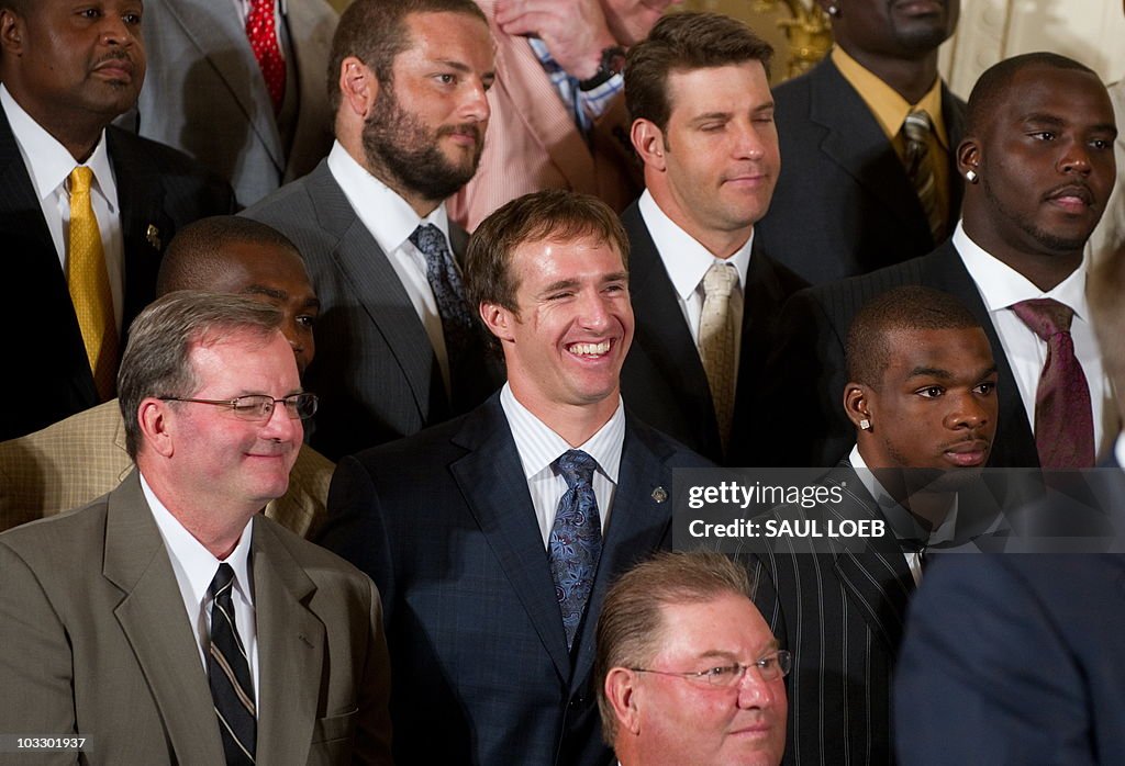 Super Bowl MVP Drew Brees (C) laughs as