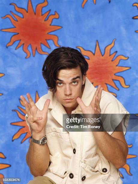 Singer Robbie Williams of English boy band Take That, circa 1994.