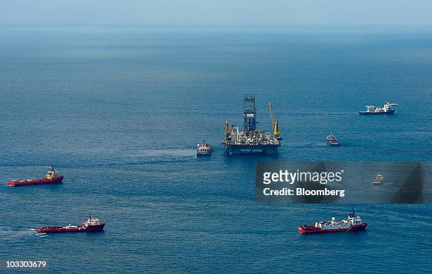 Support vessels work around Transocean Ltd.'s Development Driller III rig, which is drilling the primary relief well at the BP Plc Macondo site in...