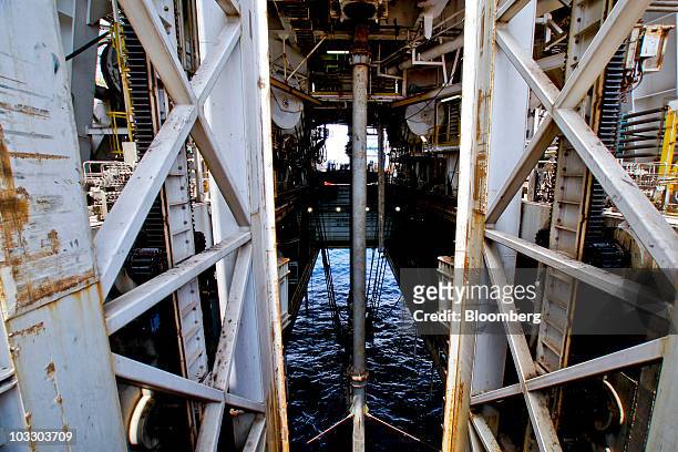 Riser pipe connected to the well head 5,000 feet below the surface of the water is seen from the moon pool on board the Transocean Ltd. Development...