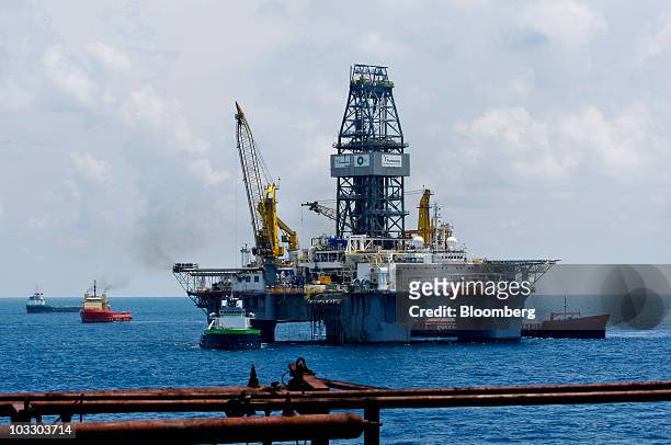 Transocean Ltd.'s Development Driller III rig works to drill a primary relief well as seen from the deck of the Development Driller II rig at the BP...
