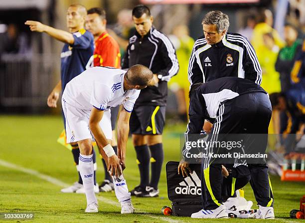 Pepe of Real Madrid speaks with coach Jose Mourinho after an injury during the pre-season friendly soccer match against of Los Angeles Galaxy on...