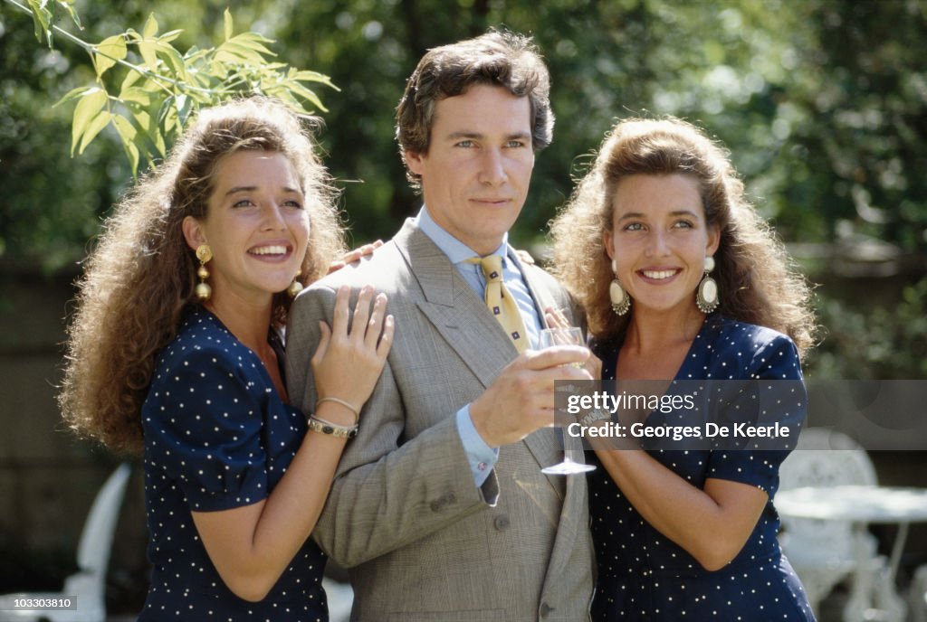 Simon Dutton Model British actor Simon Dutton poses with twin sisters Sabine and Camille ...