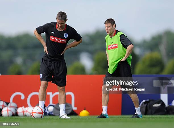 Gary Cahill and James Milner warm up during the England training session at London Colney on August 9, 2010 in St Albans, England.