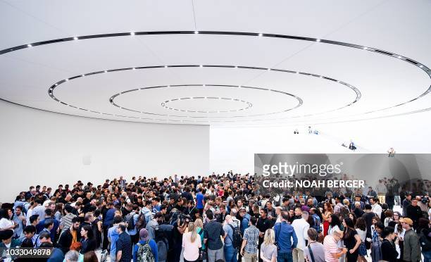Attendees gather for a product launch event at Apple's Steve Jobs Theater on September 12 in Cupertino, California. - New iPhones set to be unveiled...