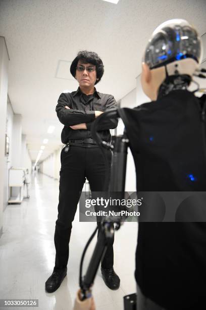 In this photo taken on September 13, 2018 shows Robot engineer Hiroshi Ishiguro and his 10 year old child android robot called...