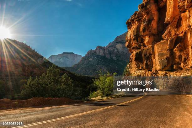 road through mountains in utah - utah mountain range stock pictures, royalty-free photos & images