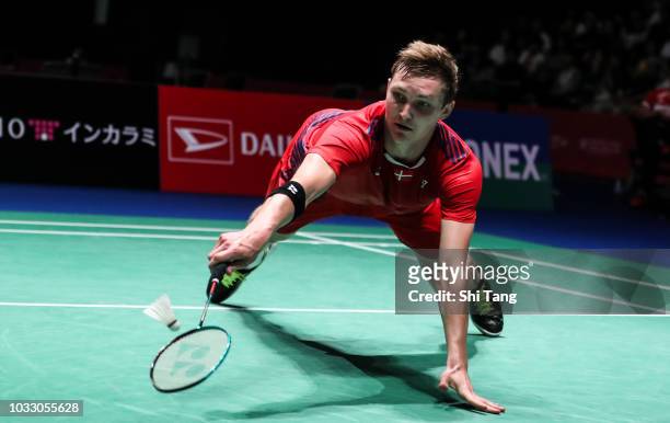 Viktor Axelsen of Denmark competes in the Men's Singles quarter finals against Anthony Sinisuka Ginting of Indonesia on day four of the Yonex Japan...