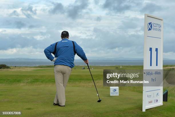 Costantino Rocca of Italy waits to play his tee shot to the 11th hole during Day One of the Scottish Senior Open at Craigielaw Golf Club on September...