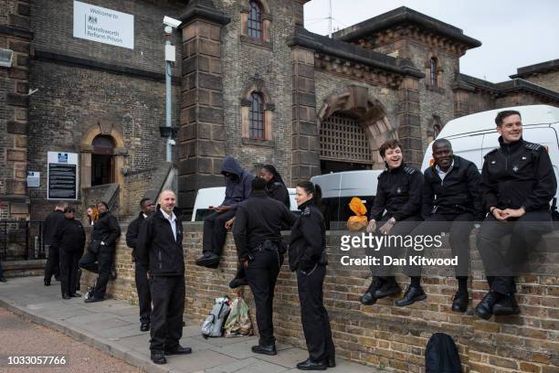 Prison staff at H.M.P Wandsworth gather outside after staging a 'walk-out' on September 14, 2018 in London, England. The Prison Officers Association...