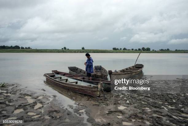 Man secures his boats on the bank of the Cagayan River ahead of Typhoon Mangkhut's arrival in Tuguegarao, Cagayan province, the Philippines, on...