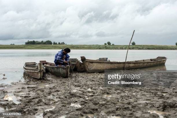 Man secures his boats on the bank of the Cagayan River ahead of Typhoon Mangkhut's arrival in Tuguegarao, Cagayan province, the Philippines, on...