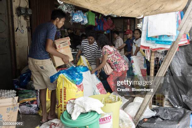 People purchase groceries at a market ahead of Typhoon Mangkhut's in Tuguegarao, Cagayan province, the Philippines, on Friday, Sept. 14, 2018....