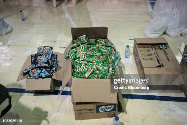 Packets of Milo chocolate-malt drink sit in a box at a makeshift disaster relief operations center ahead of Typhoon Mangkhut's arrival in Tuguegarao,...