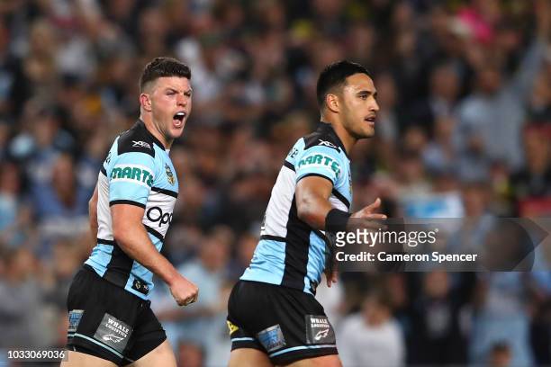 Chad Townsend of the Sharks celebrates kicking a field goal with team mate Valentine Holmes during the NRL Semi Final match between the Cronulla...