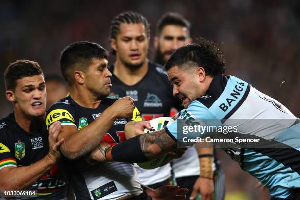 Andrew Fifita of the Sharks is tackled during the NRL Semi Final match between the Cronulla Sharks and the Penrith Panthers at Allianz Stadium on...