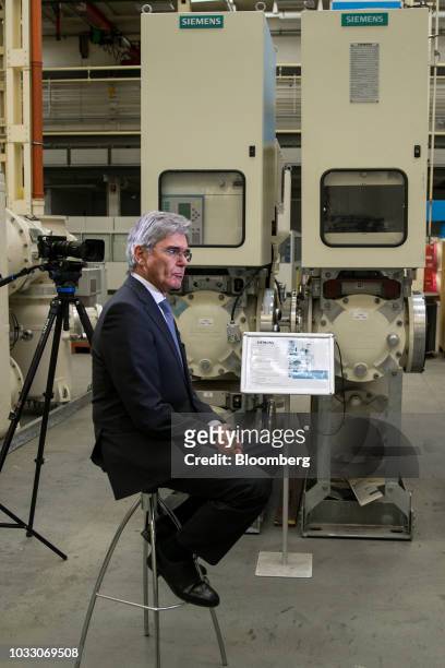 Joe Kaeser, chief executive officer of Siemens AG, pauses during a Bloomberg Television interview on the factory floor at the Siemens switchgear...