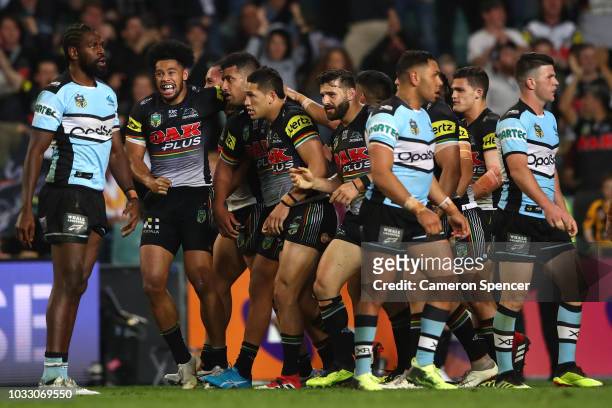 Panthers players congratulate Waqa Blake of the Panthers after scoring a try during the NRL Semi Final match between the Cronulla Sharks and the...