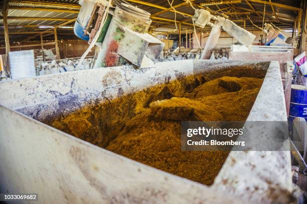 Livestock feed is churned in a mixing machine on the Ehlerskroon farm, outside Delmas in the Mpumalanga province, South Africa on Thursday, Sept. 13,...