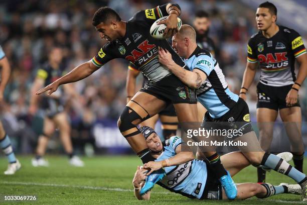 Viliame Kikau of the Panthers is tackled during the NRL Semi Final match between the Cronulla Sharks and the Penrith Panthers at Allianz Stadium on...