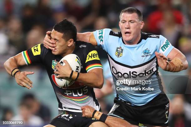 Dallin Watene Zelezniak of the Panthers is tackled by Paul Gallen of the Sharks during the NRL Semi Final match between the Cronulla Sharks and the...