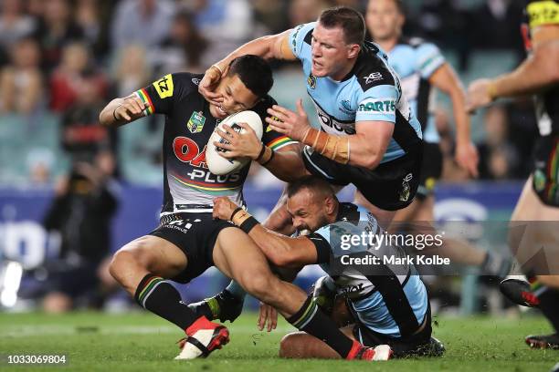 Dallin Watene Zelezniak of the Panthers is tackled by Paul Gallen of the Sharks during the NRL Semi Final match between the Cronulla Sharks and the...