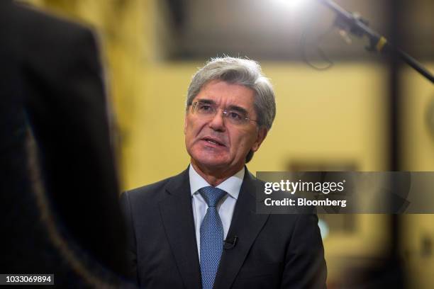 Joe Kaeser, chief executive officer of Siemens AG, speaks during a Bloomberg Television interview on the factory floor at the Siemens switchgear...