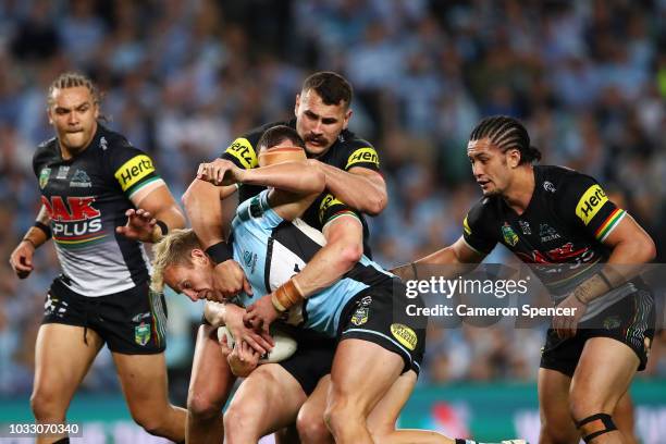 Matt Prior of the Sharks is tackled during the NRL Semi Final match between the Cronulla Sharks and the Penrith Panthers at Allianz Stadium on...