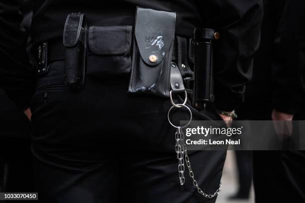 Utility belt and keychain is seen on a man as prison staff gather outside HM Prison Bedford during an unofficial protest on September 14, 2018 in...