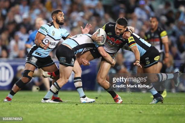 Dallin Watene Zelezniak of the Panthers is tackled during the NRL Semi Final match between the Cronulla Sharks and the Penrith Panthers at Allianz...
