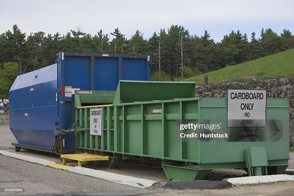 Cardboard Only recycling container connected to compactor