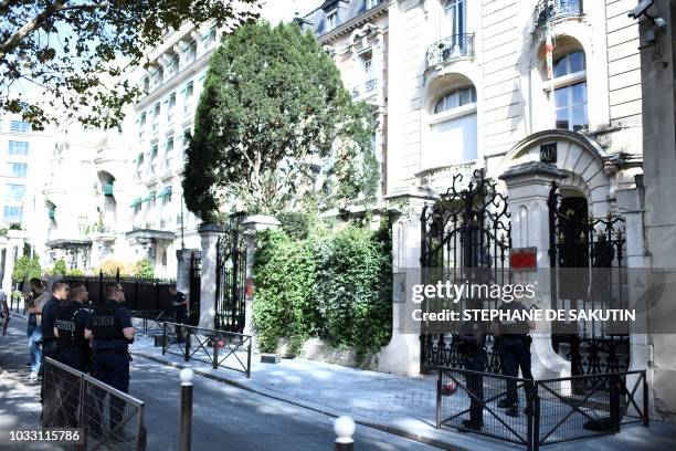 French police stand guard outside the Iranian Embassy in the French capital Paris on September 14 after people taking part in a demonstration in a...