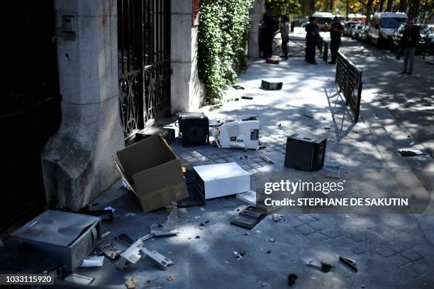 Computers litter the pavement outside the Iranian Embassy in the French capital Paris on September 14 after people taking part in a demonstration in...