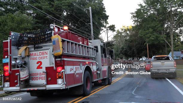 Malden Fire Department engine rushes down Route 133 in Andover, MA in response to a series of fires and gas explosions in the area on Sep. 13, 2018....