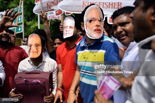 Members of Indian Youth Congress protest against Finance Minister Arun Jaitley and businessman Vijay Mallya at Udyog Bhawan, on September 14, 2018 in...