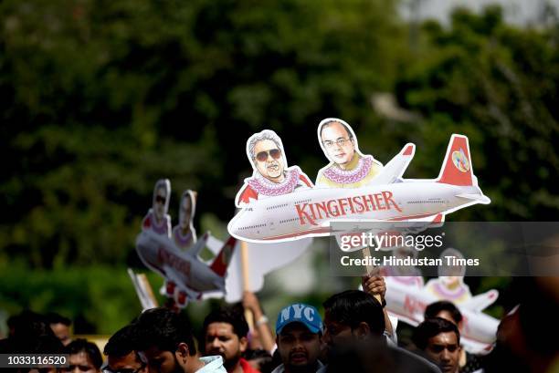 Members of Indian Youth Congress protest against Finance Minister Arun Jaitley and businessman Vijay Mallya at Udyog Bhawan, on September 14, 2018 in...