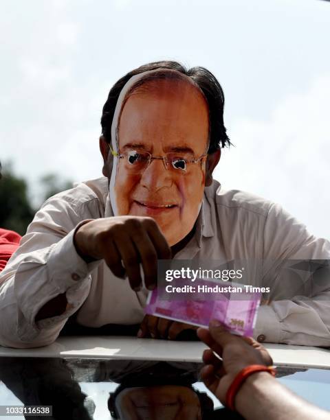 Members of Indian Youth Congress protest against Finance Minister Arun Jaitley and businessman Vijay Mallya at Udyog Bhawan, on September 14, 2018 in...