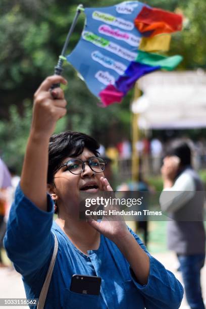 Member of the Students’ Union shouts slogans in support of candidates during Jawaharlal Nehru University Students Union Elections, at the JNU campus,...