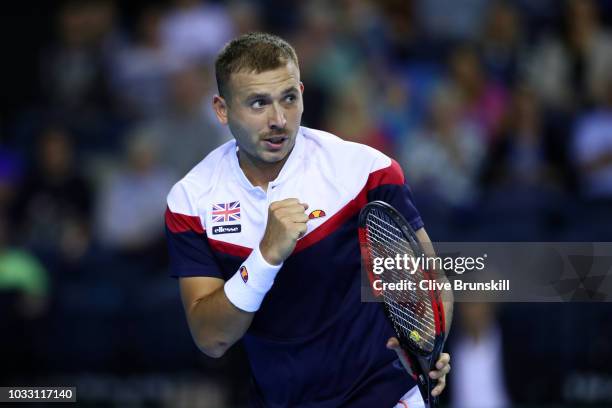 Dan Evans of Great Britain celebrates in his match against Denis Istomin of Uzbekistan during day one of the Davis Cup by BNP Paribas World Group...