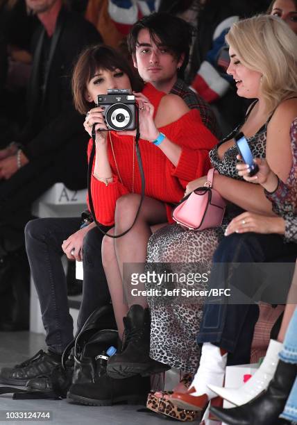Daisy Lowe takes a picture as she attends the Marta Jakubowski Show during London Fashion Week September 2018 at The BFC Show Space on September 14,...